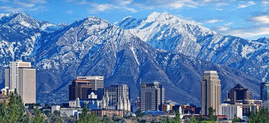 Skyline of downtown Salt Lake City with the Towering Wasatch Mountain range in the background